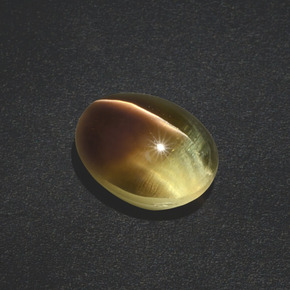 Натуральный коричневый sillimanite cat's eye 3,02 карата огранка овал, полупрозрачный