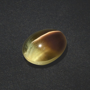 Натуральный коричневый sillimanite cat's eye 3,02 карата огранка овал, полупрозрачный