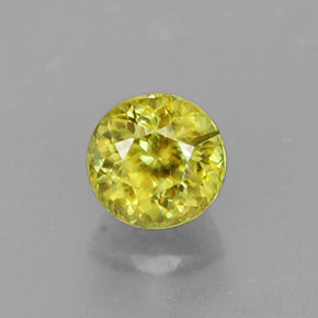 Натуральный жёлтый сфен 0,63 карата огранка круг, VS-SI