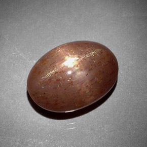 6.85 карата, натуральный Золотисто-коричневый Звездчатый Солнечный Камень, Огранка Овал, Непрозрачный