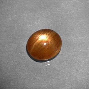1.34 карата, натуральный Золотисто-коричневый Звездчатый Солнечный Камень, Огранка Овал, Непрозрачный