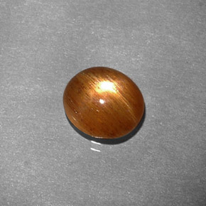 1.34 карата, натуральный Золотисто-коричневый Звездчатый Солнечный Камень, Огранка Овал, Непрозрачный
