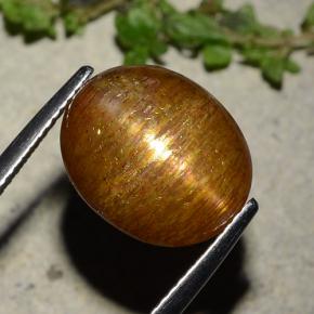 Натуральный золотисто-коричневый звёздчатый солнечный камень 8,81 карата огранка овал, непрозрачный