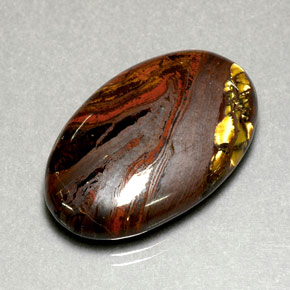 Натуральный многоцветный tiger's eye matrix 35,49 карата огранка овал, непрозрачный