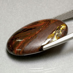 Натуральный многоцветный tiger's eye matrix 35,49 карата огранка овал, непрозрачный