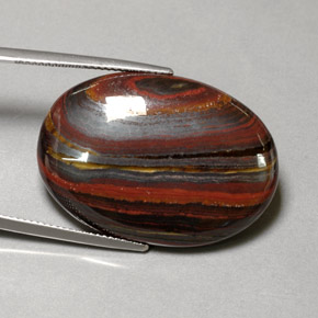 Натуральный многоцветный tiger's eye matrix 45,58 карата огранка овал, непрозрачный