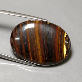 Натуральный многоцветный tiger's eye matrix 43,53 карата огранка овал, непрозрачный