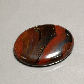 Натуральный многоцветный tiger's eye matrix 41,60 карата огранка овал, непрозрачный