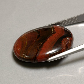 Натуральный многоцветный tiger's eye matrix 41,60 карата огранка овал, непрозрачный
