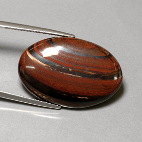 Натуральный многоцветный tiger's eye matrix 35,01 карата огранка овал, непрозрачный