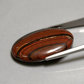 Натуральный многоцветный tiger's eye matrix 35,01 карата огранка овал, непрозрачный