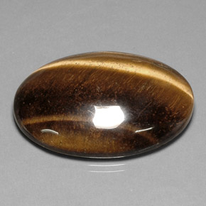 Натуральный коричневый tiger's eye 78,03 карата огранка овал, непрозрачный