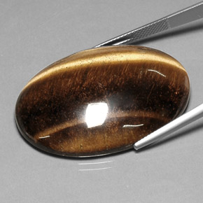 Натуральный коричневый tiger's eye 78,03 карата огранка овал, непрозрачный