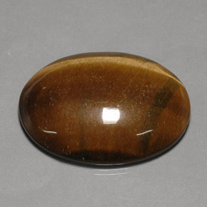 Натуральный коричневый tiger's eye 75,77 карата огранка овал, непрозрачный