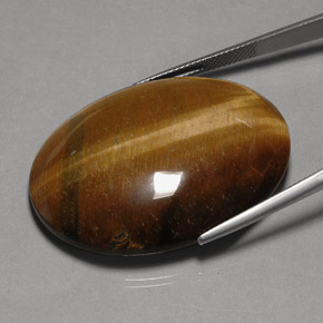 Натуральный коричневый tiger's eye 75,77 карата огранка овал, непрозрачный