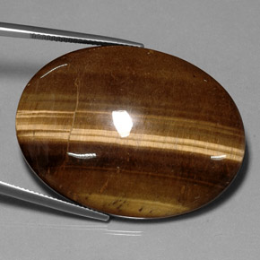 Натуральный коричневый tiger's eye 75,05 карата огранка овал, непрозрачный