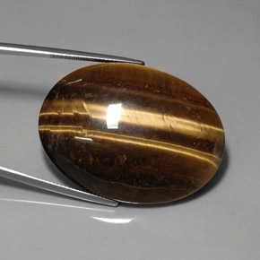 Натуральный коричневый tiger's eye 76,92 карата огранка овал, непрозрачный