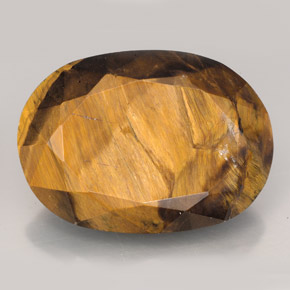 Натуральный коричневый tiger's eye 23,17 карата огранка овал, непрозрачный