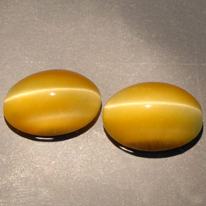 Натуральный жёлтый tiger's eye  карата огранка овал, непрозрачный