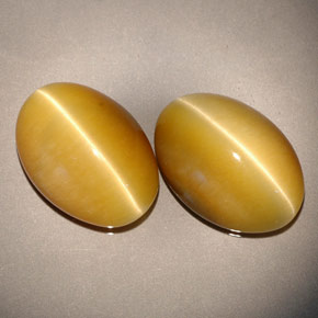 Натуральный жёлтый tiger's eye  карата огранка овал, непрозрачный