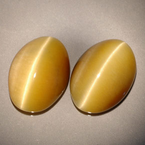 Натуральный жёлтый tiger's eye  карата огранка овал, непрозрачный