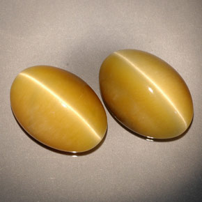 Натуральный жёлтый tiger's eye  карата огранка овал, непрозрачный
