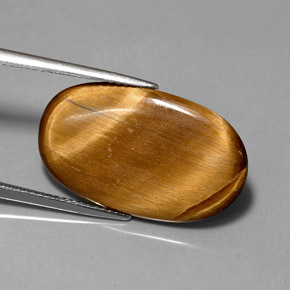 Натуральный коричневый tiger's eye 10,07 карата огранка овал, непрозрачный