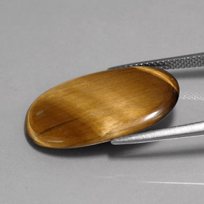 Натуральный коричневый tiger's eye 10,07 карата огранка овал, непрозрачный