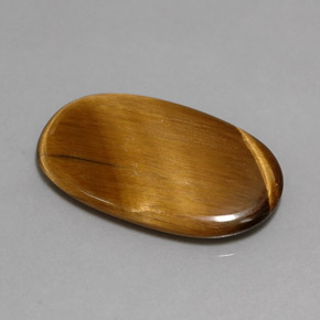 Натуральный коричневый tiger's eye 10,07 карата огранка овал, непрозрачный