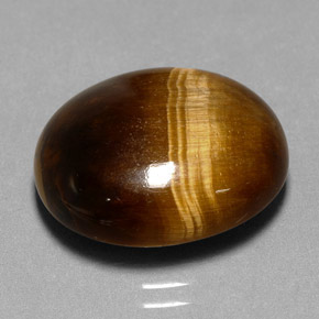 Натуральный коричневый tiger's eye 11,35 карата огранка овал, непрозрачный