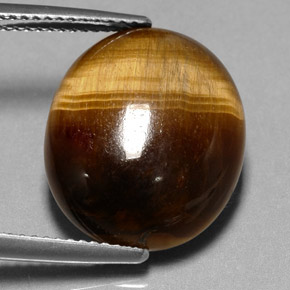 Натуральный коричневый tiger's eye 11,35 карата огранка овал, непрозрачный