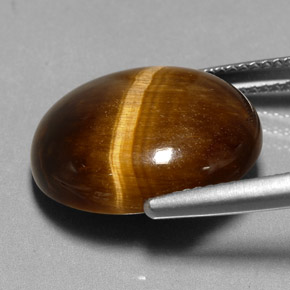 Натуральный коричневый tiger's eye 11,35 карата огранка овал, непрозрачный