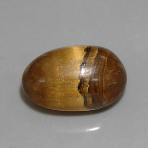 Натуральный коричневый tiger's eye 12,90 карата огранка овал, непрозрачный