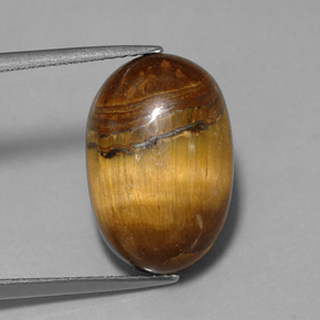 Натуральный коричневый tiger's eye 12,90 карата огранка овал, непрозрачный