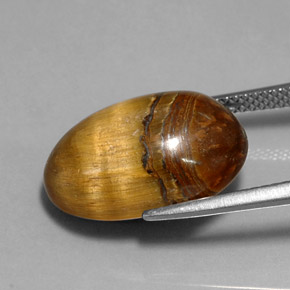 Натуральный коричневый tiger's eye 12,90 карата огранка овал, непрозрачный