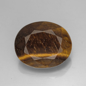 Натуральный коричневый tiger's eye 25,78 карата огранка овал, непрозрачный