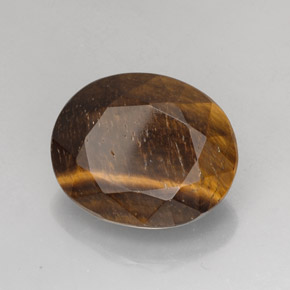 Натуральный коричневый tiger's eye 25,78 карата огранка овал, непрозрачный
