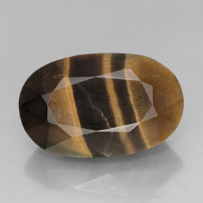 Натуральный многоцветный tiger's eye 13,19 карата огранка овал, непрозрачный