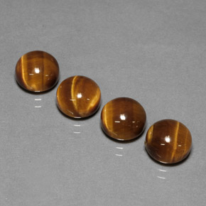 Натуральный коричневый tiger's eye  карата огранка круг, непрозрачный