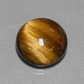 Натуральный коричневый tiger's eye 11,12 карата огранка круг, непрозрачный