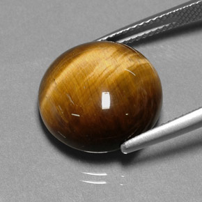 Натуральный коричневый tiger's eye 11,12 карата огранка круг, непрозрачный