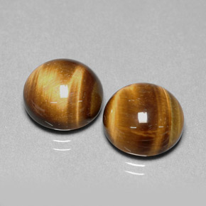 Натуральный коричневый tiger's eye  карата огранка круг, непрозрачный