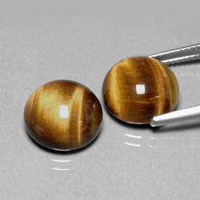 Натуральный коричневый tiger's eye  карата огранка круг, непрозрачный