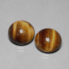 Натуральный коричневый tiger's eye  карата огранка круг, непрозрачный