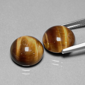 Натуральный коричневый tiger's eye  карата огранка круг, непрозрачный