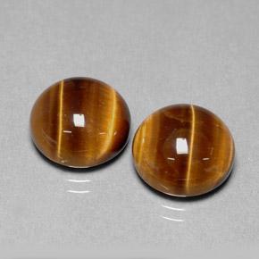 Натуральный коричневый tiger's eye  карата огранка круг, непрозрачный