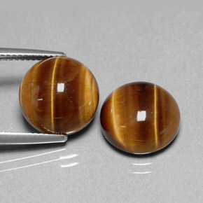 Натуральный коричневый tiger's eye  карата огранка круг, непрозрачный
