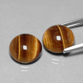 Натуральный коричневый tiger's eye  карата огранка круг, непрозрачный