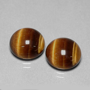 Натуральный коричневый tiger's eye  карата огранка круг, непрозрачный