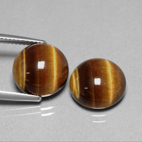 Натуральный коричневый tiger's eye  карата огранка круг, непрозрачный